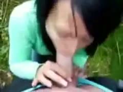 In front of the camera, a raven-haired whore is embracing and caressing my 10-Pounder.